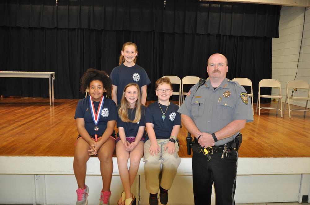 Cotter School Resource Officer, Deputy Matthew Guthrie presented his Essay winners for the 2018 graduation from left to right, Makayla Ligon, Morley Cranfill, and Konnor Winclif, the overall winner was Taylee Harvey.